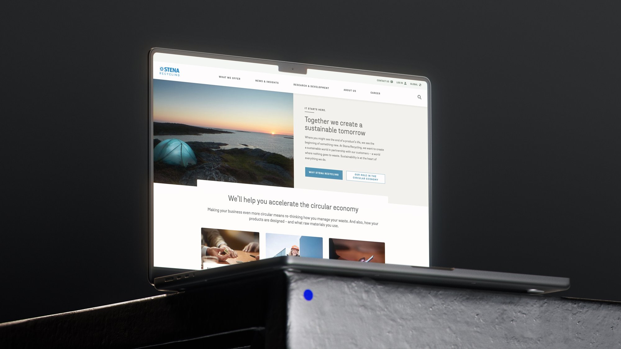 Laptop screen displaying Stena Recycling website, featuring text on sustainable practices and images of nature and business settings.