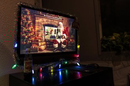 A TV screen showing Santa Claus and the interface for a CandyCam