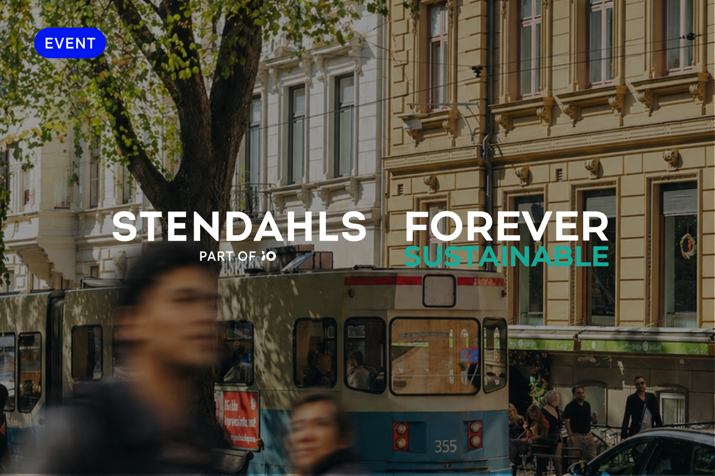 Stendahls, part of iO – Forever Sustainable. A vibrant street scene from Gothenburg, Sweden, with a tram passing through the city centre and pedestrians in motion