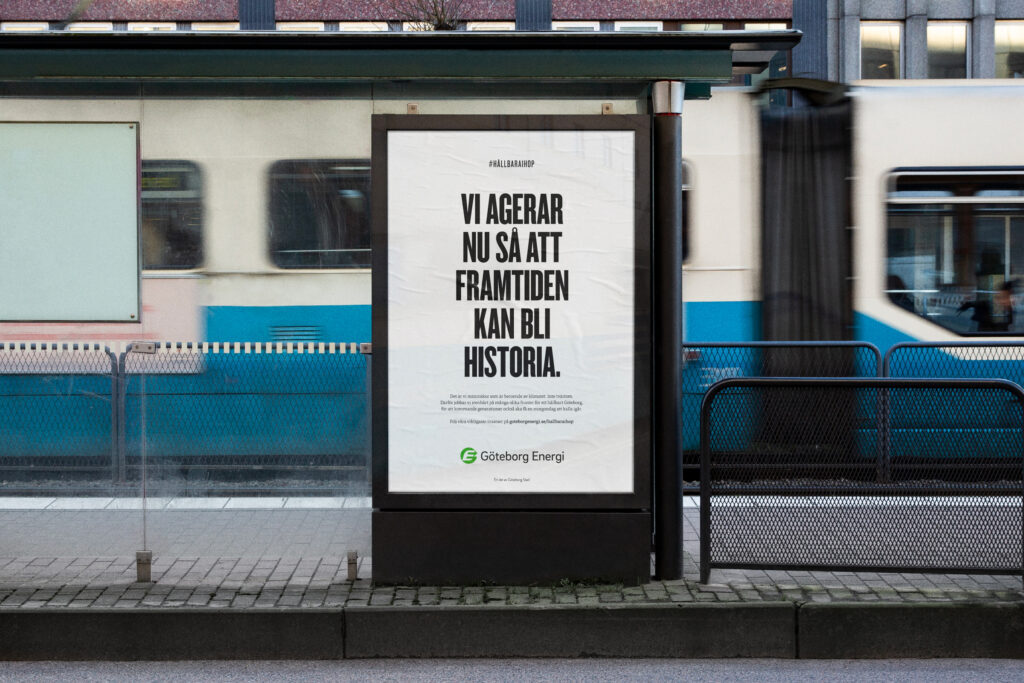Bus stop ad reads, 'Vi agerar nu så att framtiden kan bli historia.' Translation: 'We act now so that the future can become history.'