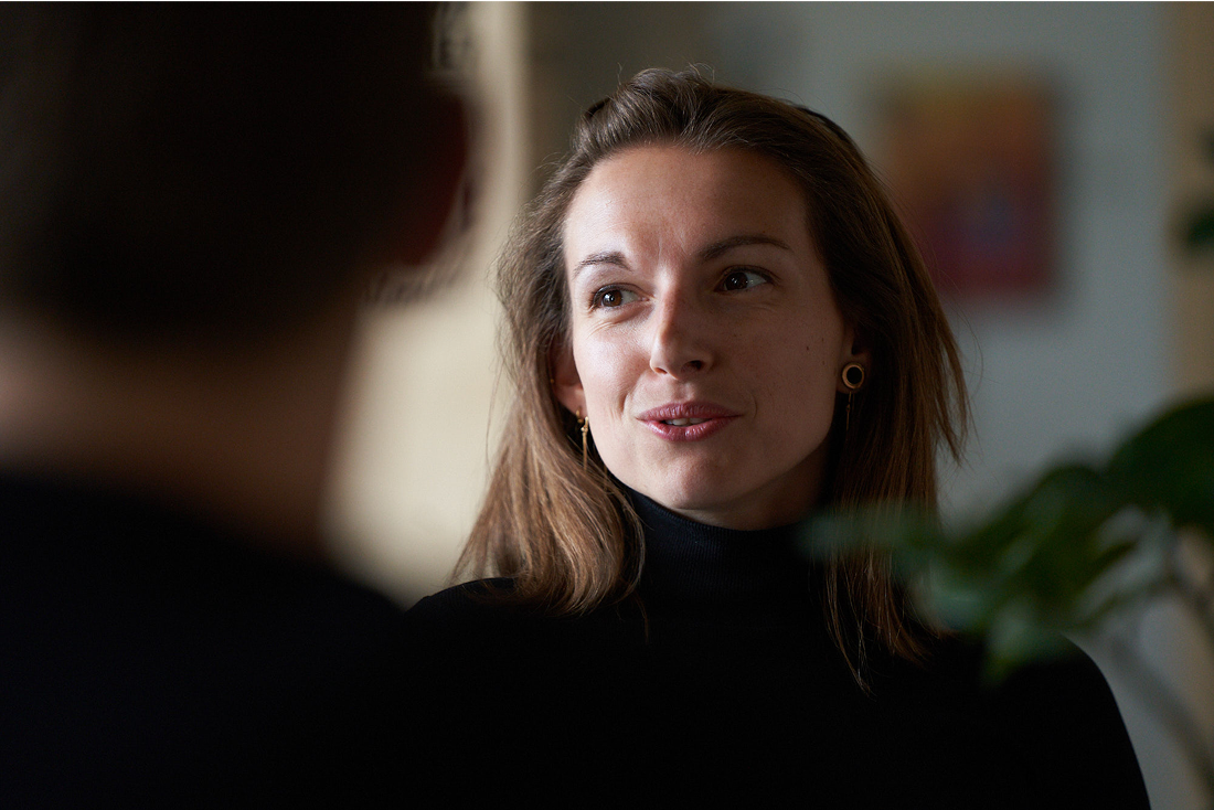 Professional engaged in conversation during office discussion