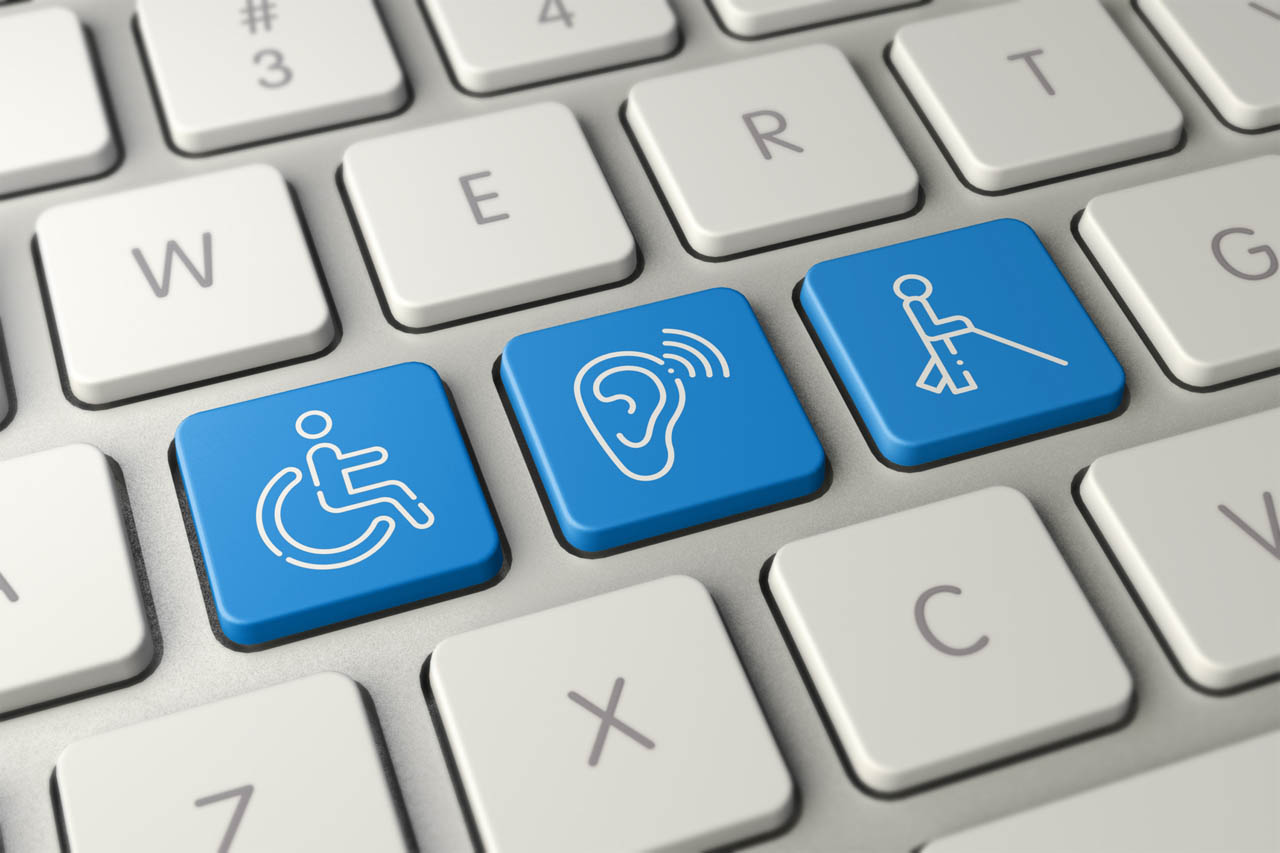Keyboard featuring blue accessibility keys for mobility, hearing, and vision assistance.