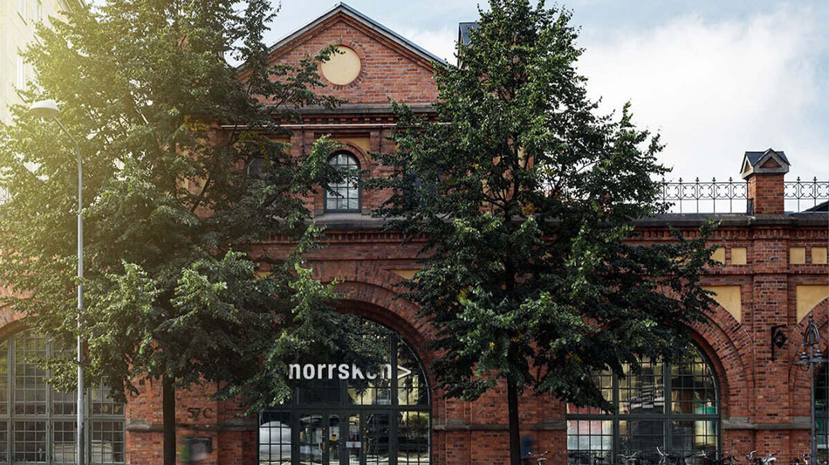 Historic red brick build with arched entrances and 