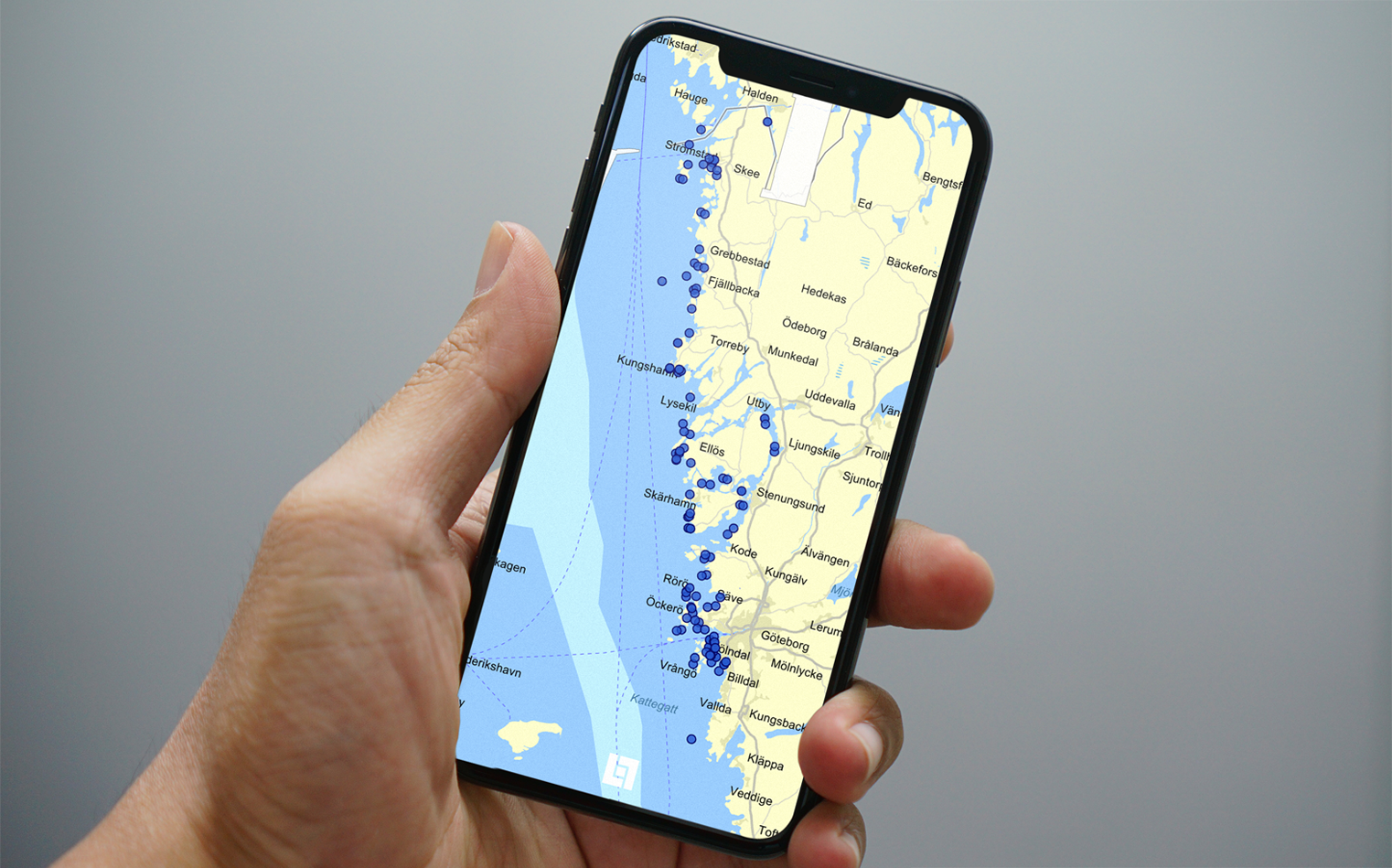 Map on a mobile screen showing locations along the Swedish west coast, marked by blue dots from Strömstad to Göteborg.